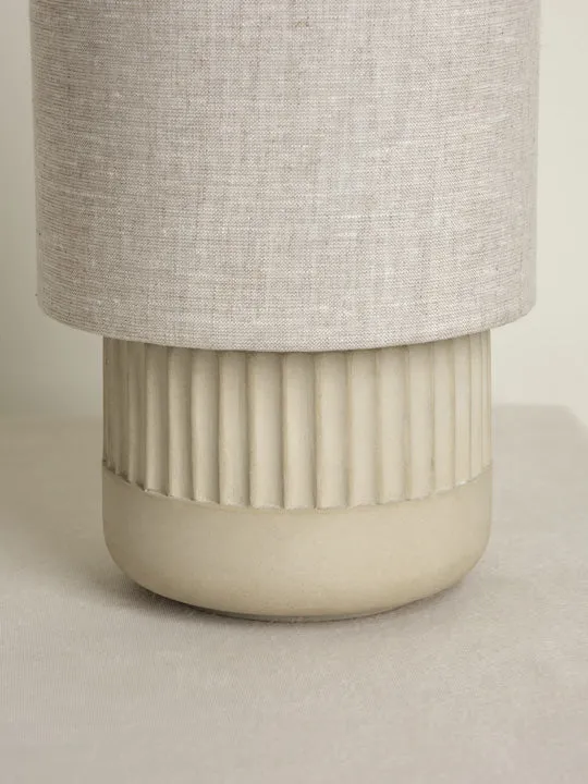 Enza - warm white ribbed concrete table lamp